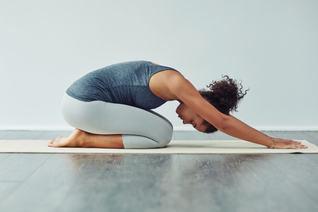 Benefits Of Yoga For Runners. Woman doing yoga.