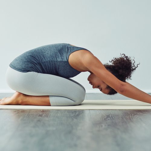 Benefits Of Yoga For Runners. Woman doing yoga.