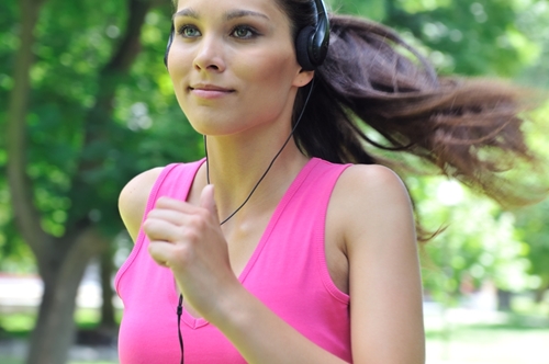 Woman running, but how often should you exercise?