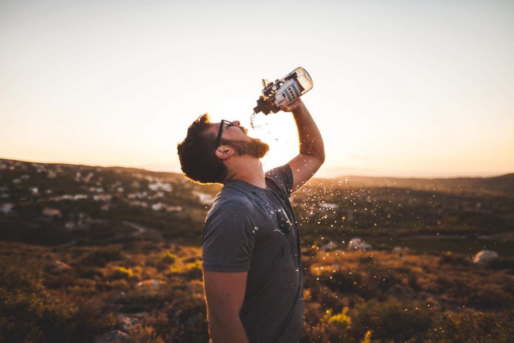 Man drinking water. Why Hydration Is Crucial.