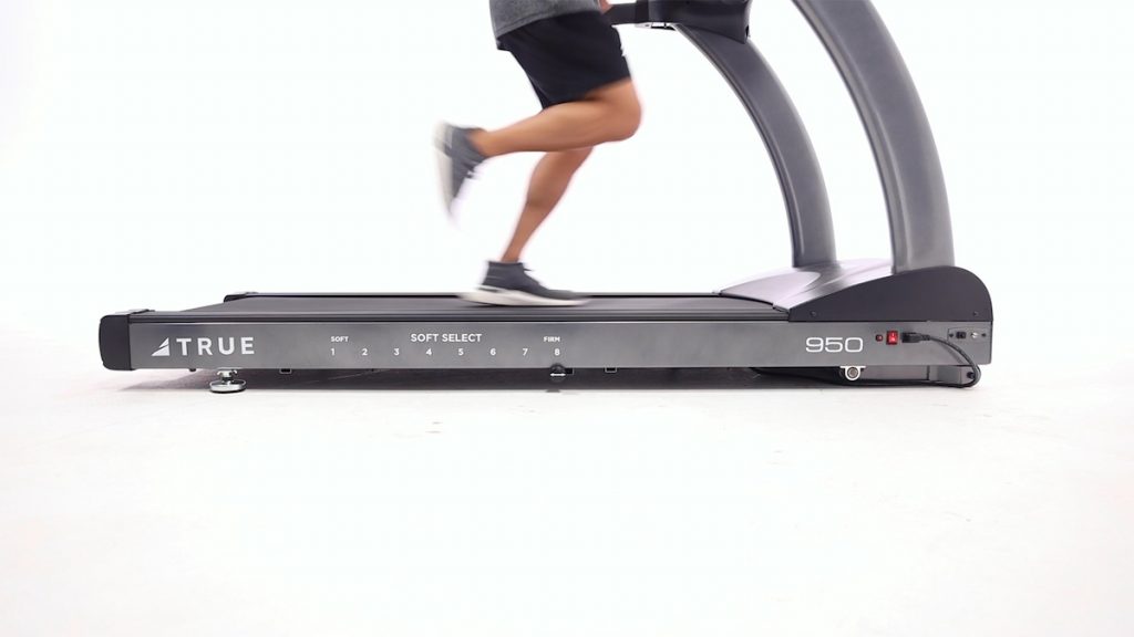 Man Running On TRUE Fitness Soft Select Treadmill. An orthopedically correct treadmill.