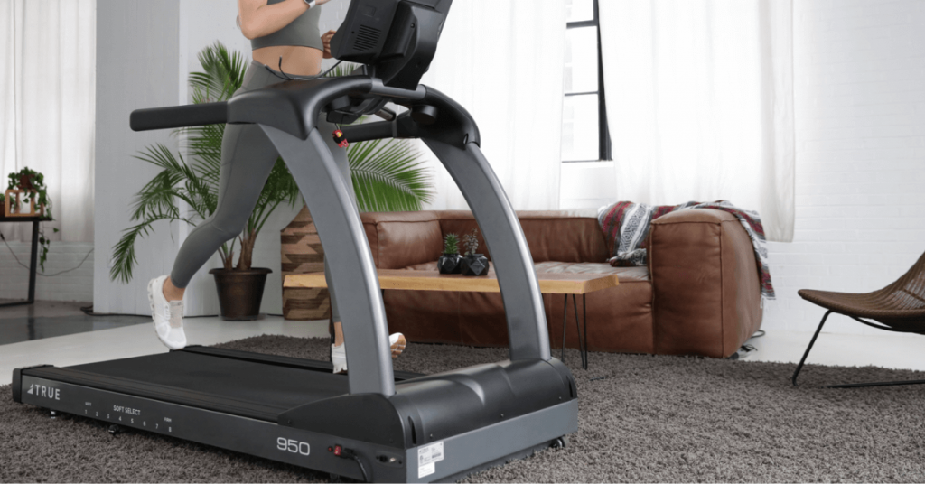 Woman Running On TRUE® S.O.F.T System Soft Select Treadmill. An orthopedically correct treadmill.