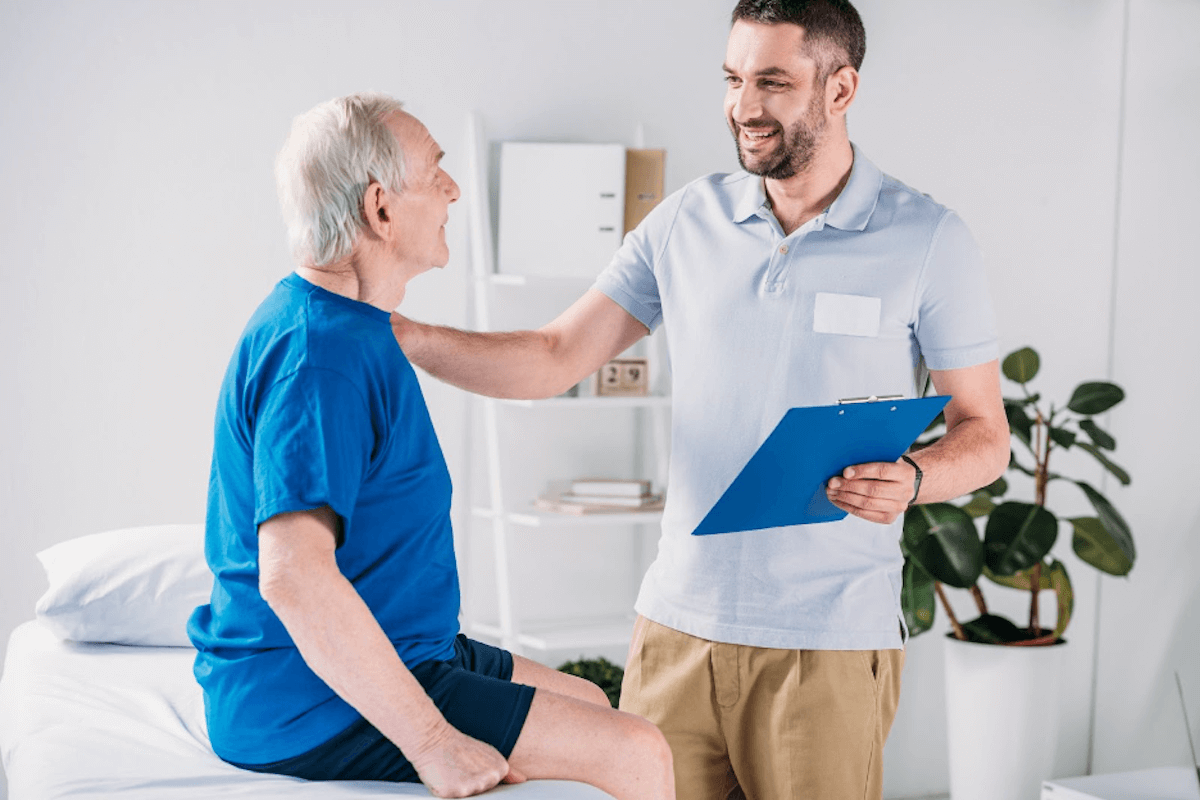 Healthcare professional informing his patient to increase his exercise.