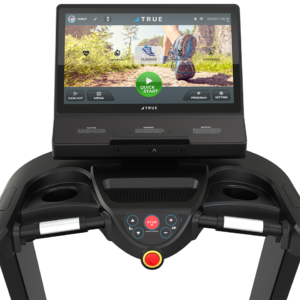 Close-up of the Performance 1000 Treadmill console featuring a large touchscreen with workout options like “Quick Start,” plus start, stop, and speed adjustment buttons on the control panel below.