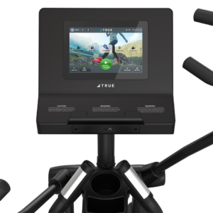 A close-up of the M50 Elliptical’s console screen shows an outdoor cycling simulation, with control buttons and handles around the display. The TRUE brand logo appears below the screen.